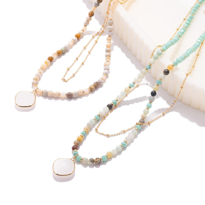 Layered Chain Link & Faceted Bead Necklace Featuring Class Crystal Pendant