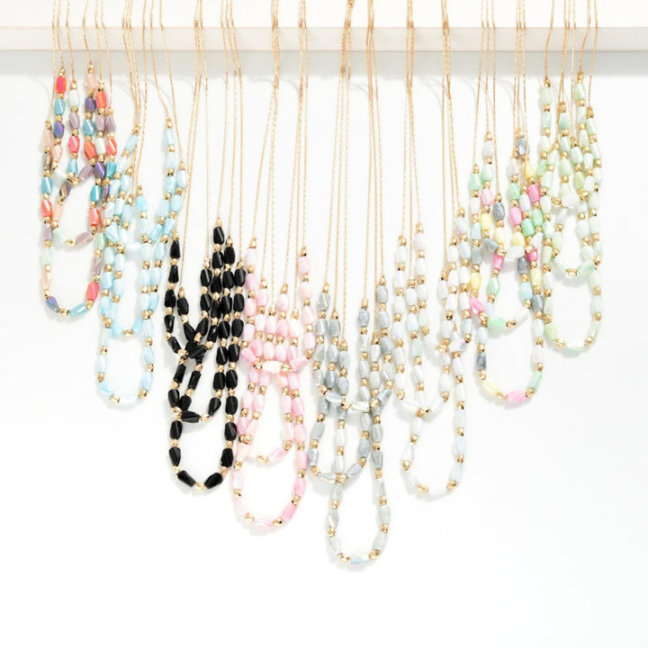 Layered Beaded Necklace Featuring Cracked Faceted Cylinder Beads
