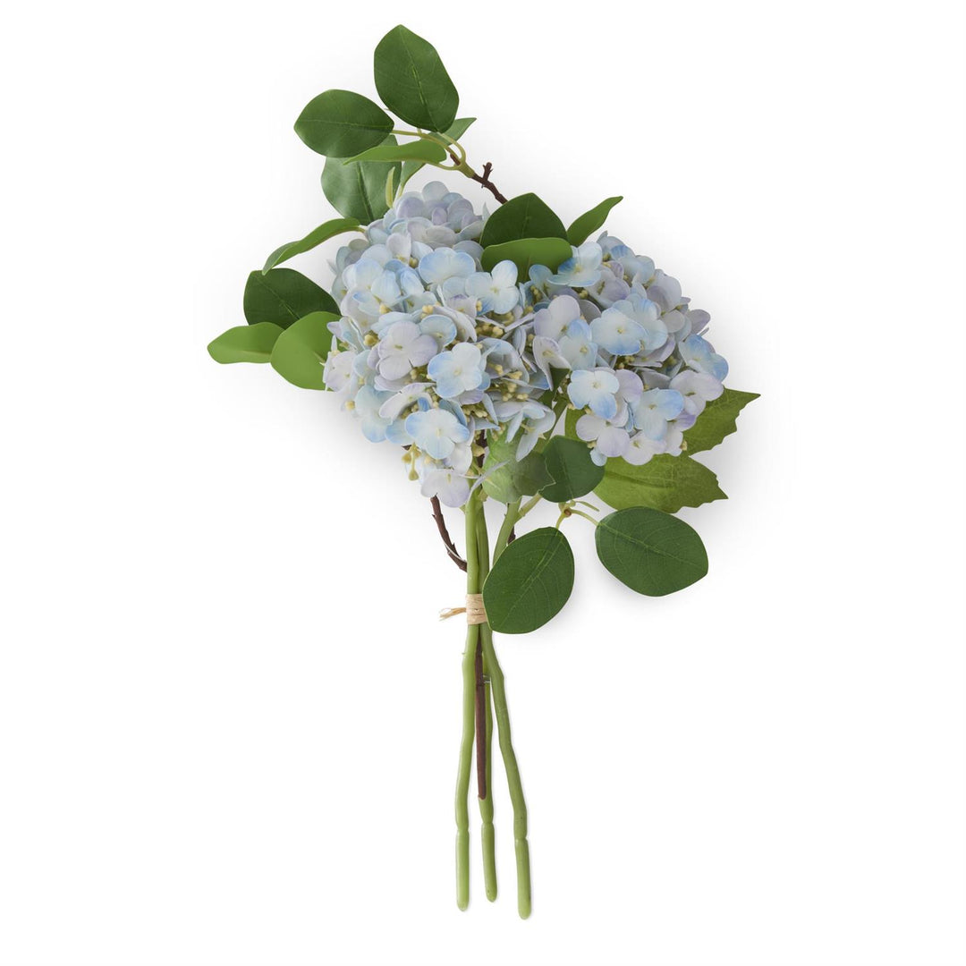 Bouquet of blue flowers with green leaves on a white background