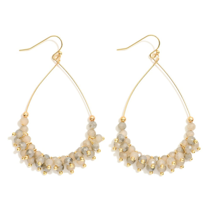 Metal Tone Wire Teardrop Earrings Featuring Faceted Bead Details