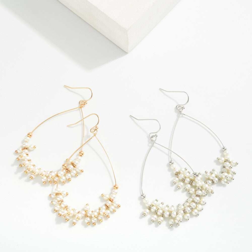 Metal Tone Wire Teardrop Earrings Featuring Faceted Bead Details