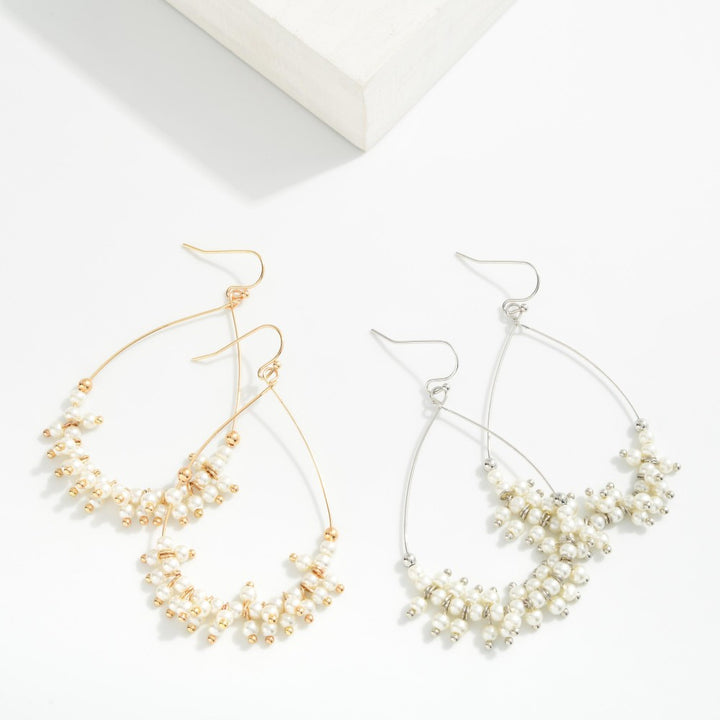 Metal Tone Wire Teardrop Earrings Featuring Faceted Bead Details
