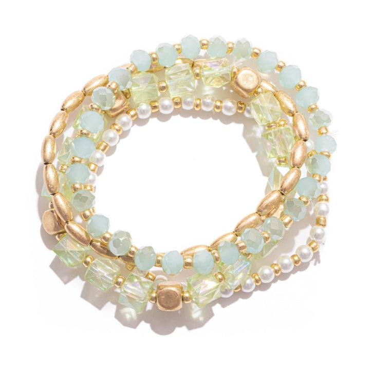 Set Of Four Beaded Stretch Bracelets Featuring Metal Tones, Pearls, & Iridescent Beads