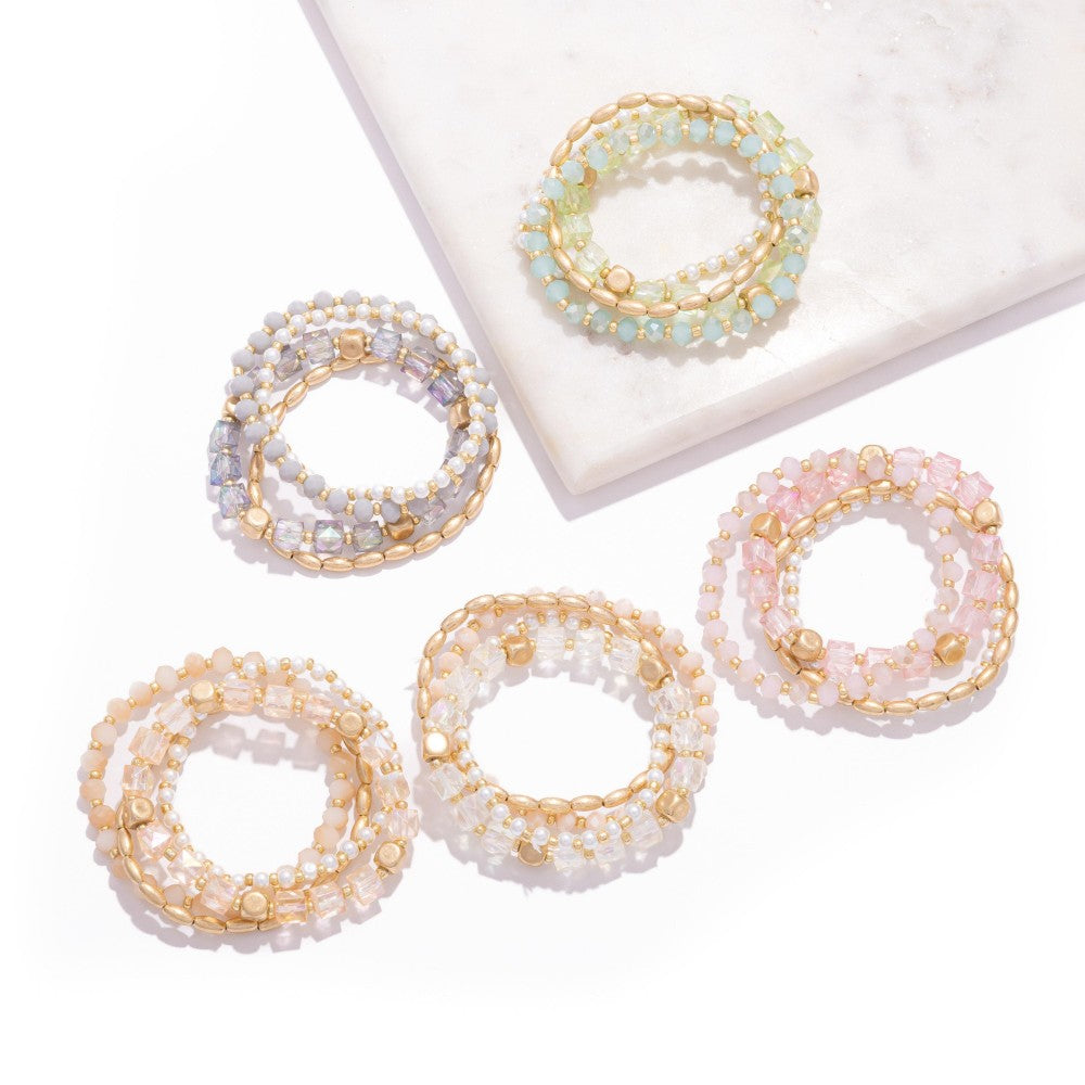 Set Of Four Beaded Stretch Bracelets Featuring Metal Tones, Pearls, & Iridescent Beads