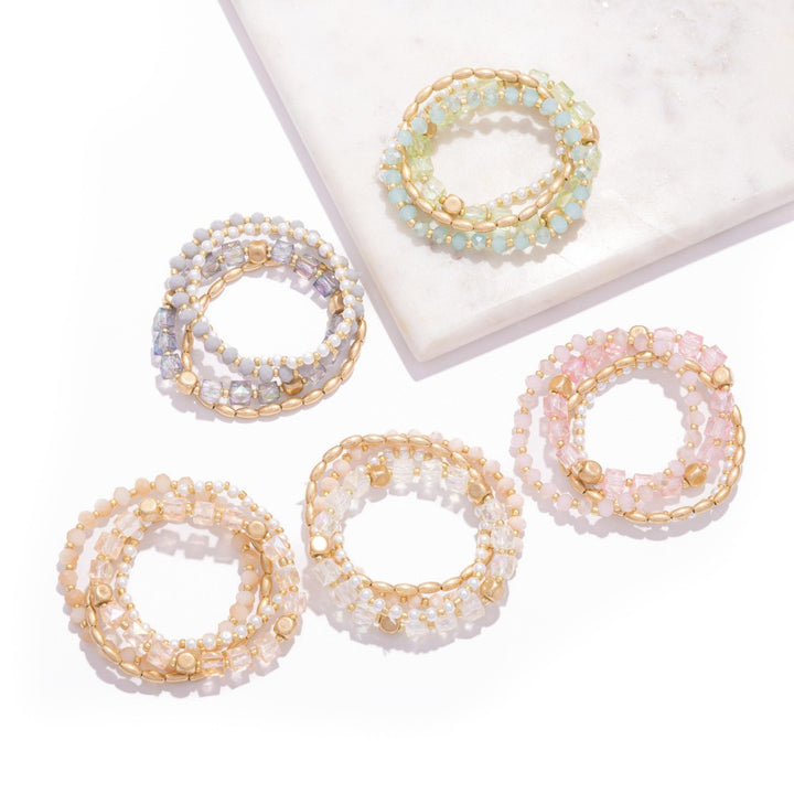 Set Of Four Beaded Stretch Bracelets Featuring Metal Tones, Pearls, & Iridescent Beads