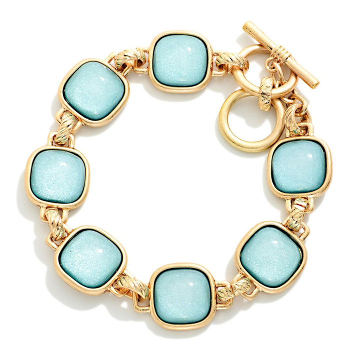 Metal Tone Bracelet Featuring Glitter Resin Squared Stations With Toggle Clasp