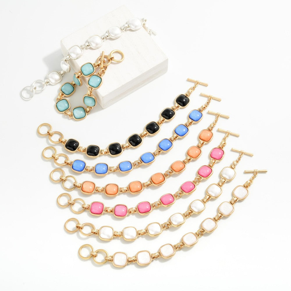 Metal Tone Bracelet Featuring Glitter Resin Squared Stations With Toggle Clasp