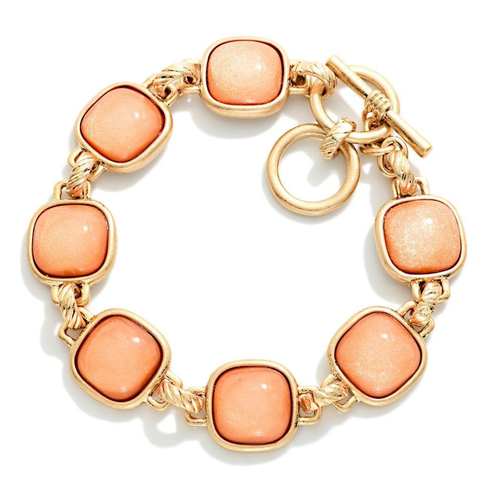 Metal Tone Bracelet Featuring Glitter Resin Squared Stations With Toggle Clasp