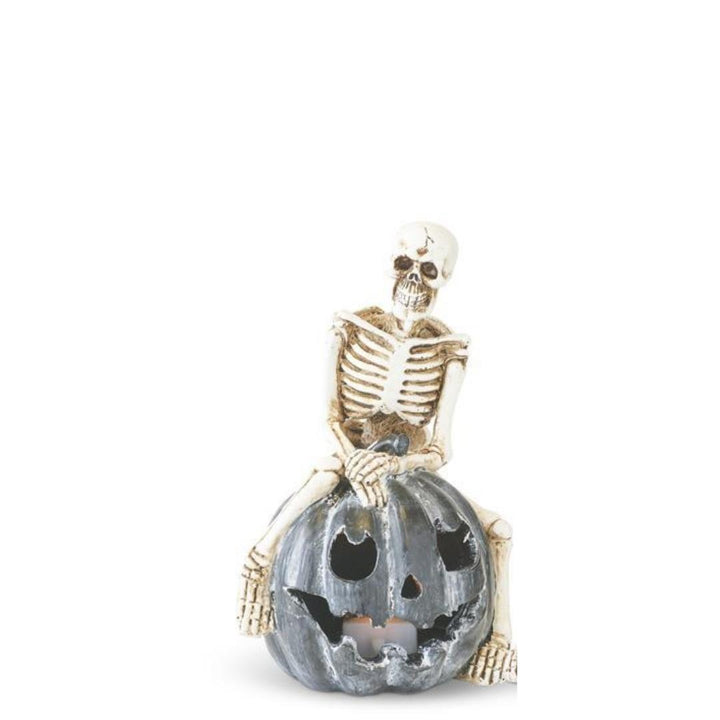 Skeleton Sitting on LED Jack O Lantern