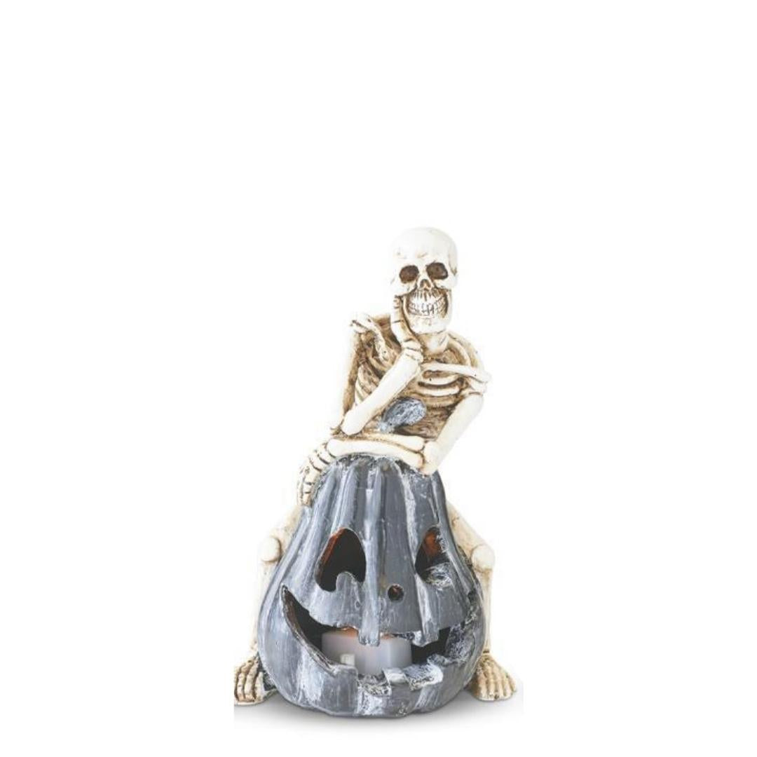 Skeleton Sitting on LED Jack O Lantern