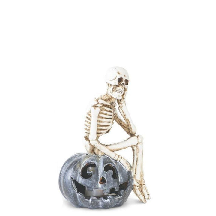 Skeleton Sitting on LED Jack O Lantern