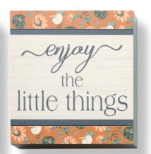 The perfect way to decorate a book shelf, entryway console or wall is with this ready-to-hang seasonal sign detailed with a pumpkin border and an inspirational sentiment: ENJOY THE LITTLE THINGS