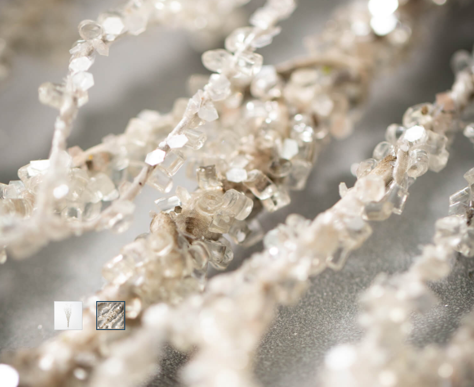 Fully covered in crystal faceted beads, this iced birch spray is plastic and extremely durable. It stands 36" tall and encompasses a bundle of wavy twigs into one amazing piece.