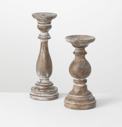 A great finish really adds to the versatility of this candleholder. Not too dark, yet not too light, it mingles seamlessly into almost any room. Mix it up by topping with decorative orbs for a unique accessory. This vintage candleholder set is perfect for farmhouse styles.